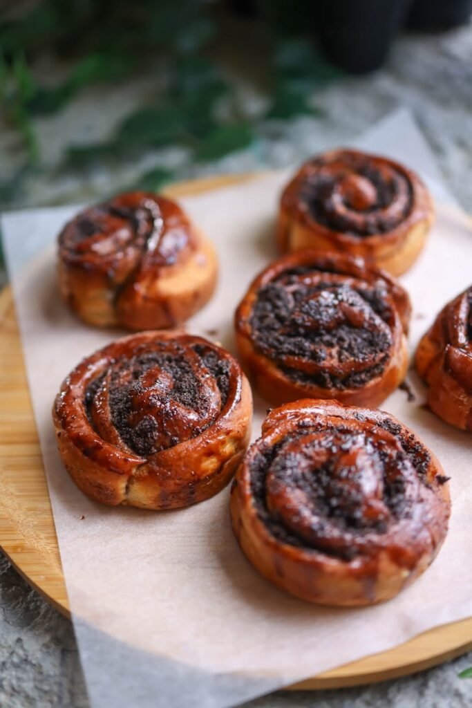 cinnamon rolls on a wooden tray