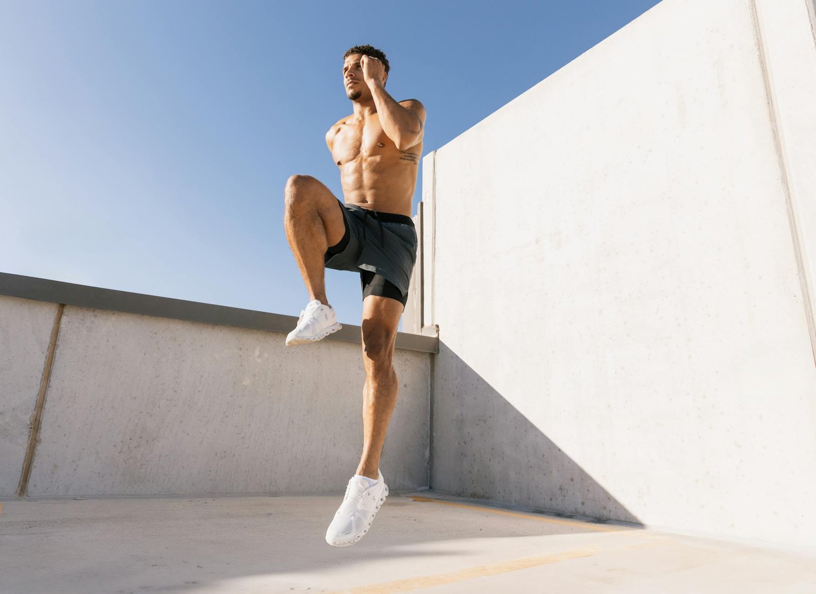 athletic man exercising on rooftop in austin