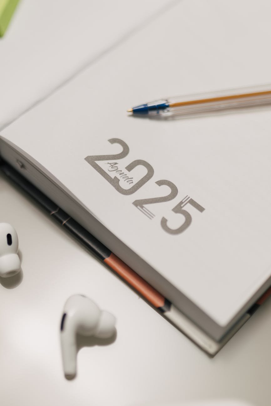 modern planner with headphones and pen