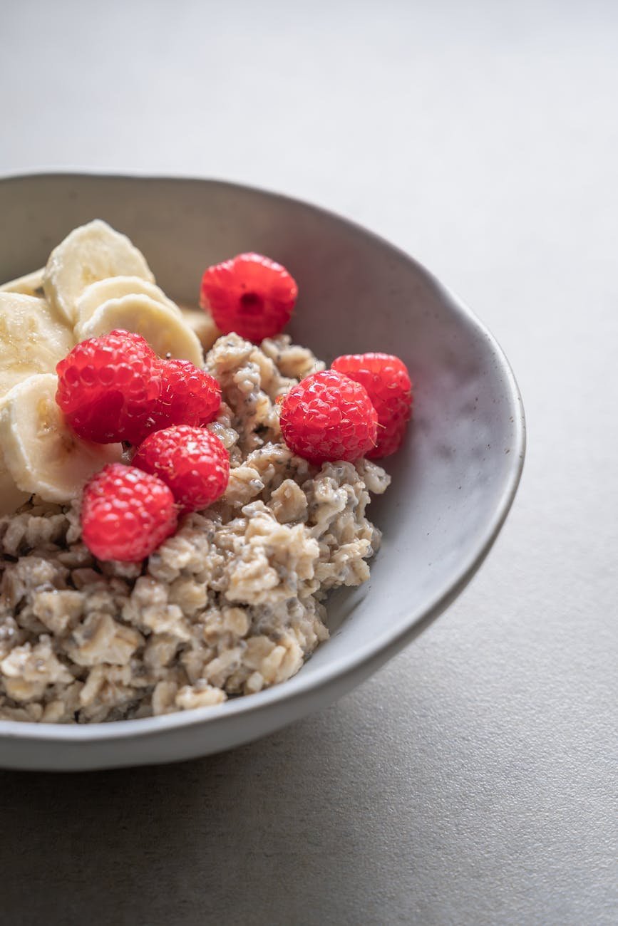 delicious oatmeal with banana and raspberry topping