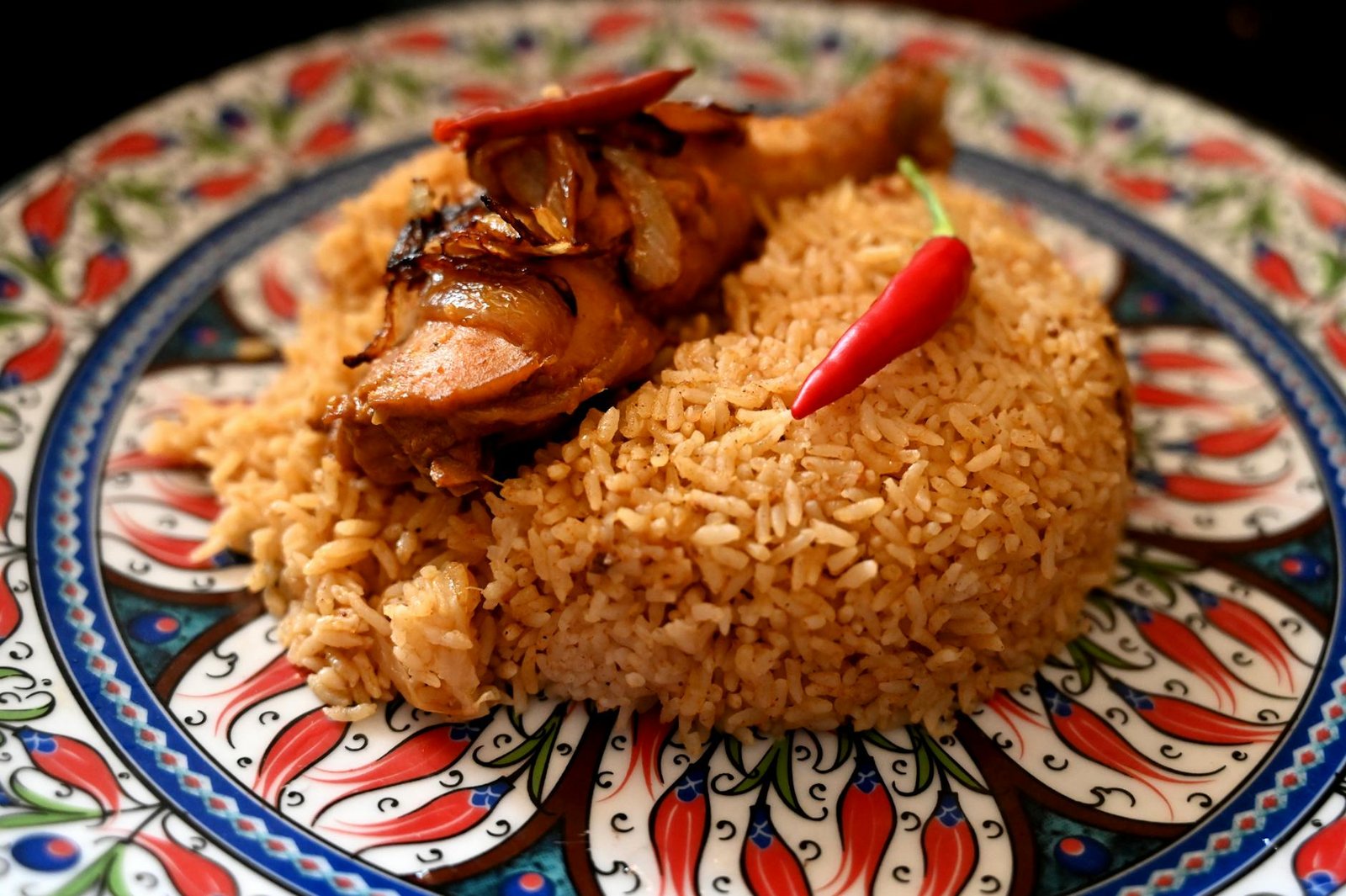 fried rice on white and red plate