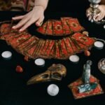 a person sitting at the table with cards