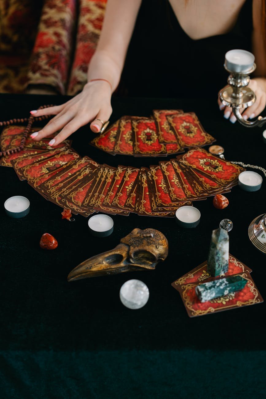 a person sitting at the table with cards