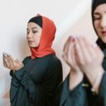 woman in black long sleeve shirt wearing red hijab