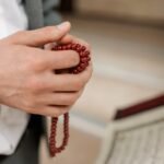 holding misbaha prayer beads