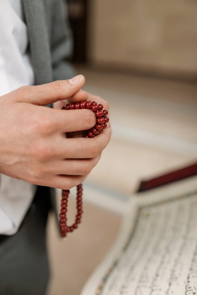 holding misbaha prayer beads
