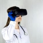 woman in white coat wearing blue and black vr goggles