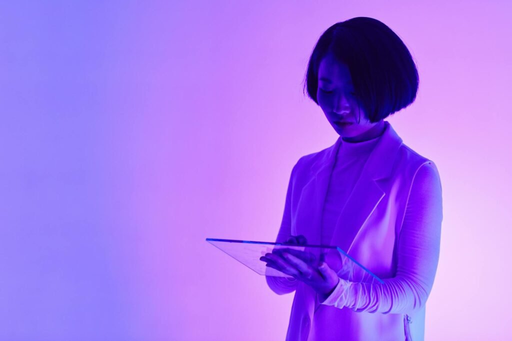a woman holding a digital tablet