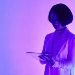 a woman holding a digital tablet