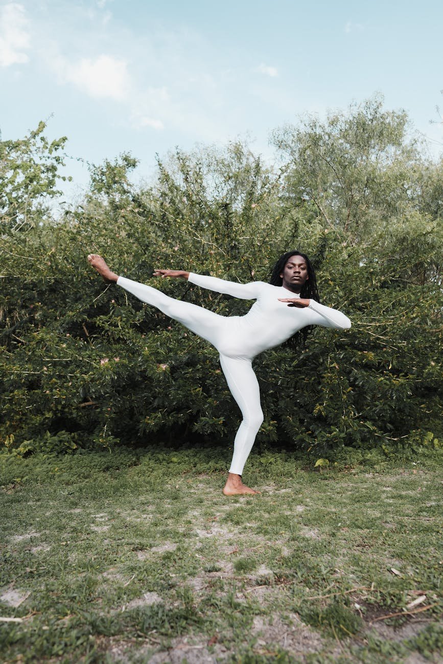 woman stretching on grass