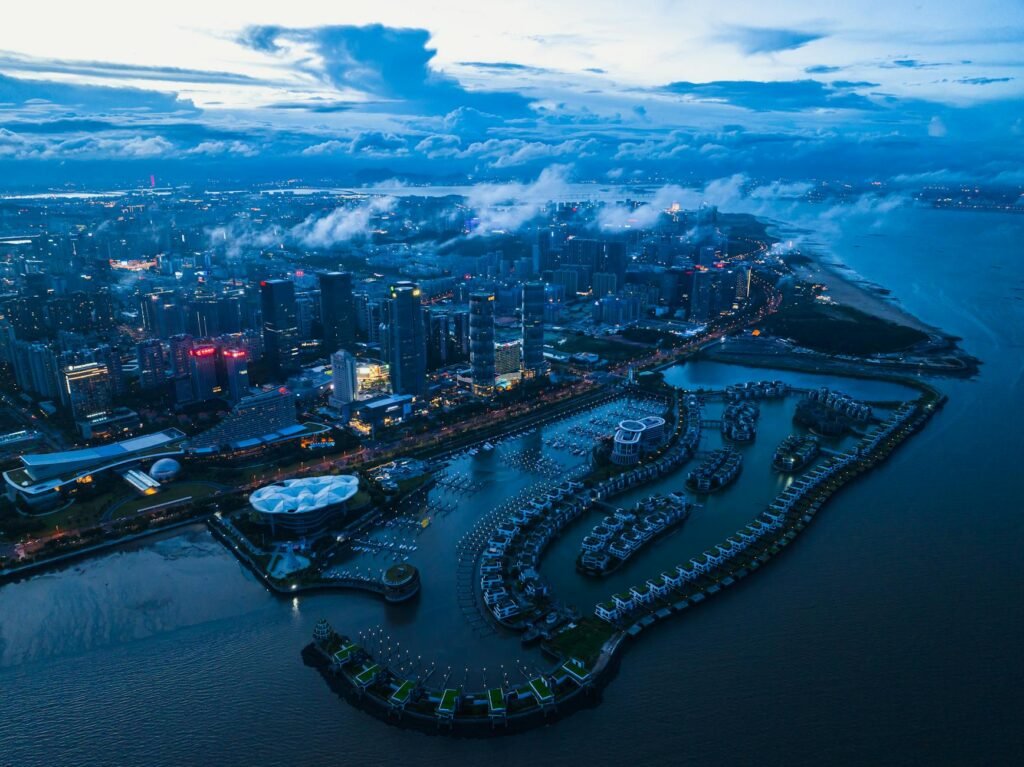 aerial view of a modern marina and skyscrapers in city on the coast