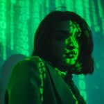 brunette illuminated with binary code