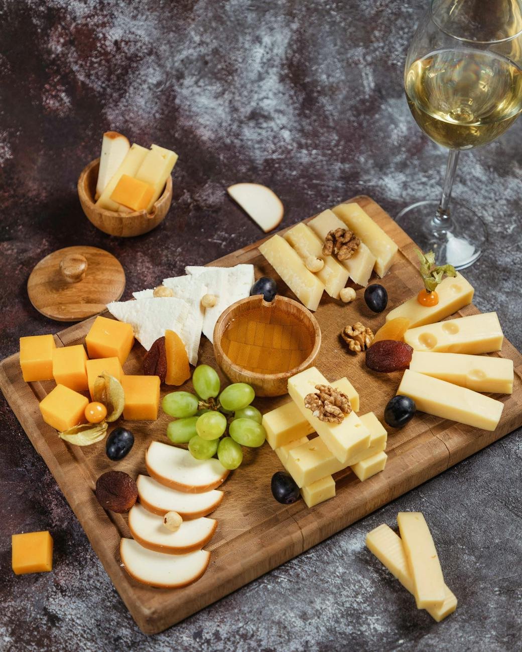 cheese platter snacks and white wine overhead