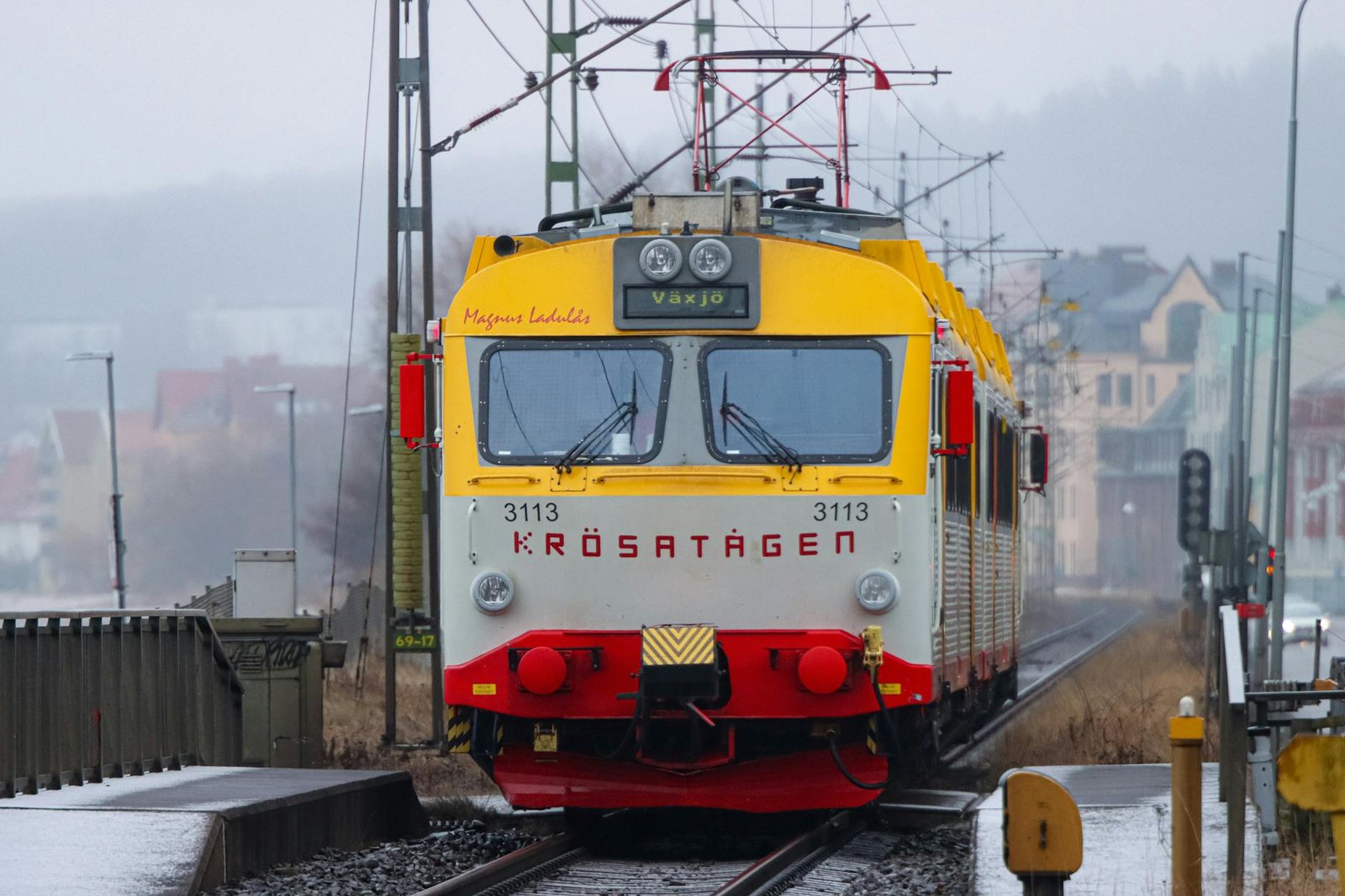 colorful train arriving at jonkoping station