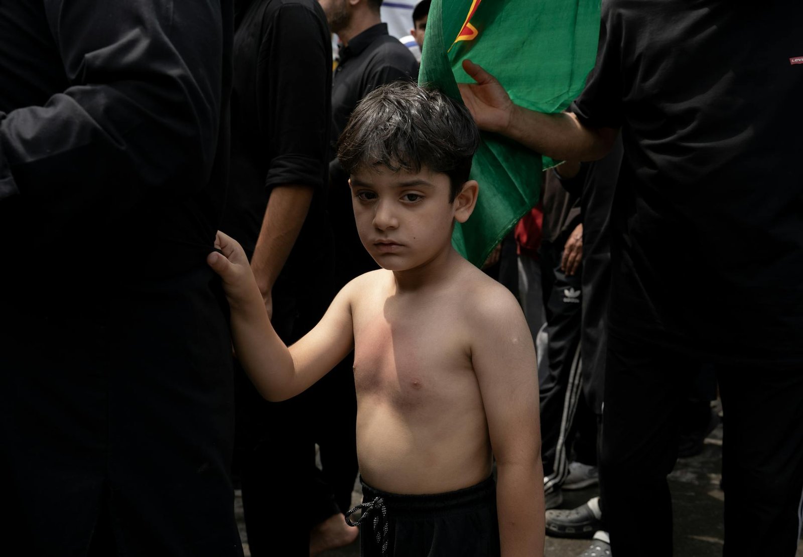young boy at ashura procession in srinagar