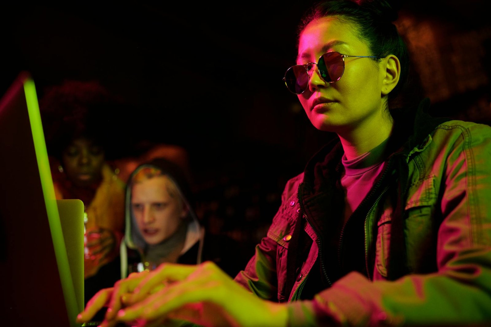 a woman typing on her laptop