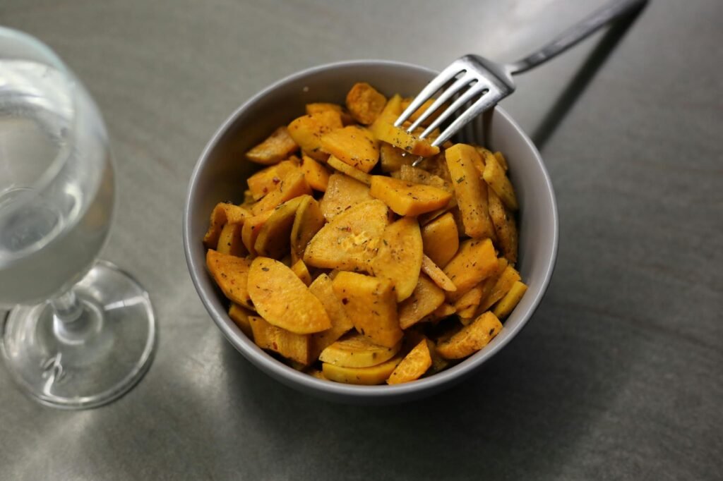 homemade fried batata served in bowl with fork