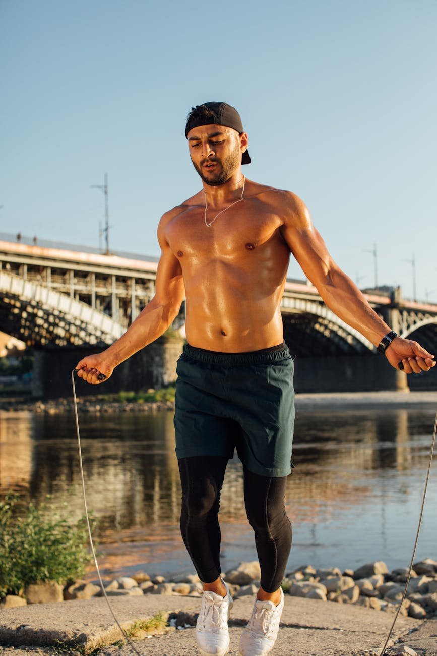 a man wearing cap using jumping rope
