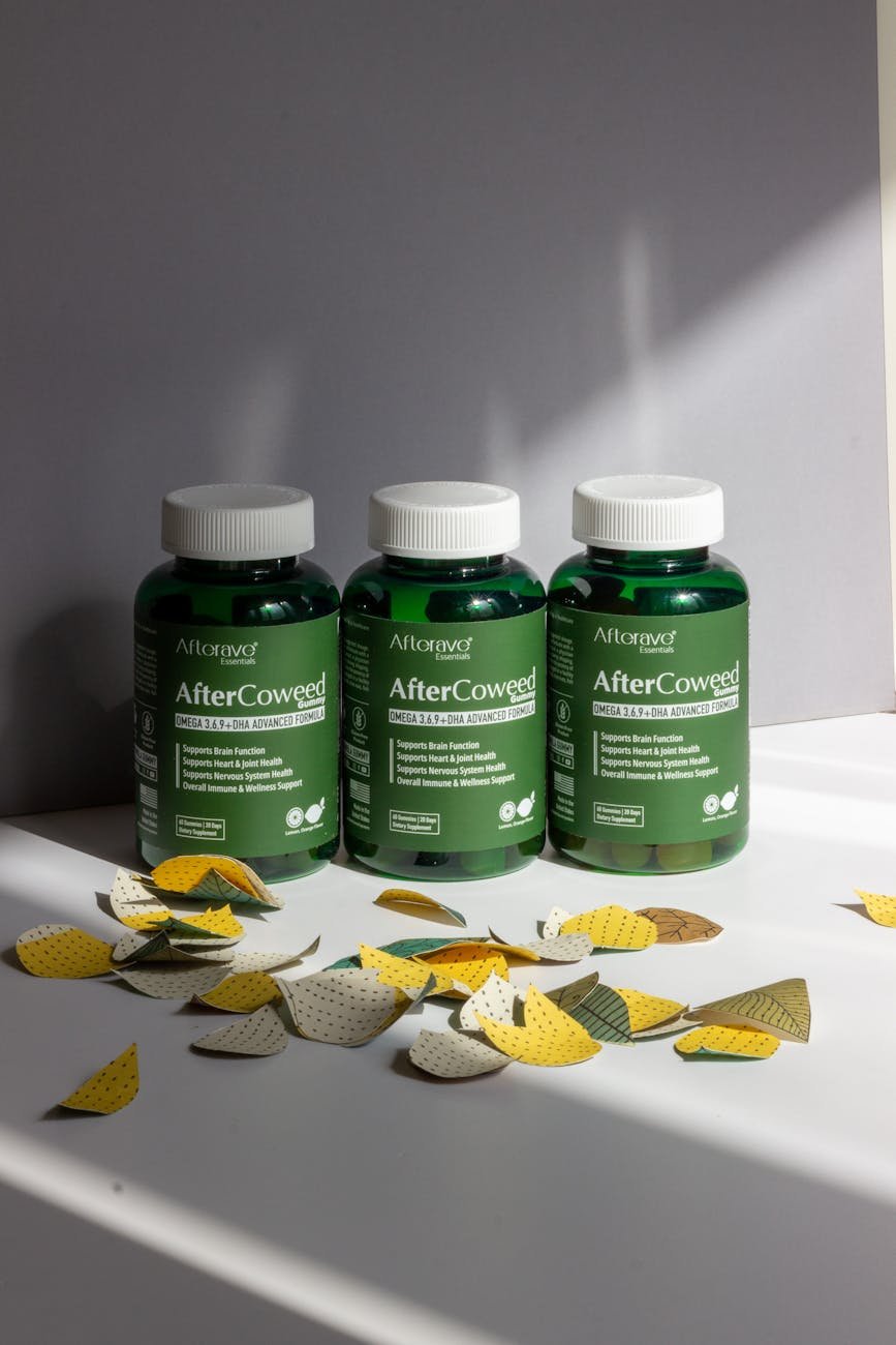 three aftercoweed supplement bottles with leaves