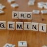 scrabble tiles spelling pro gemini on wooden table
