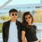 stylish young couple wearing sunglasses outdoors