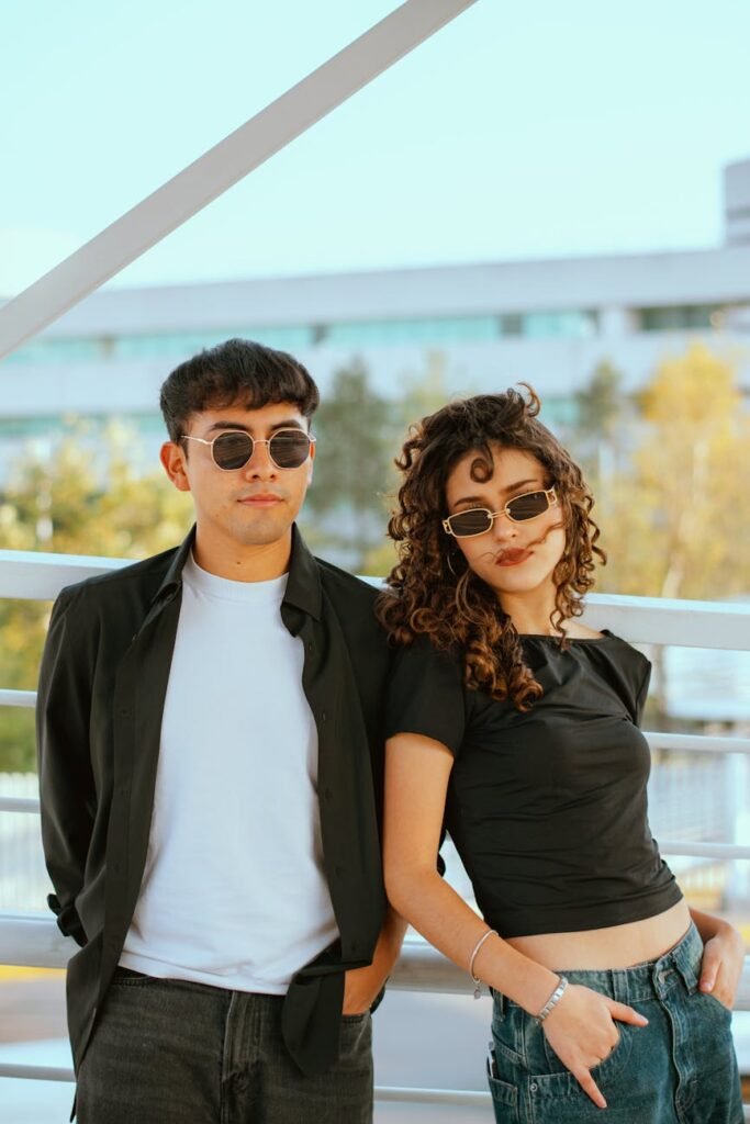 stylish young couple wearing sunglasses outdoors