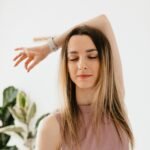 calm young woman practicing yoga meditation