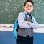 boy carrying a blue backpack