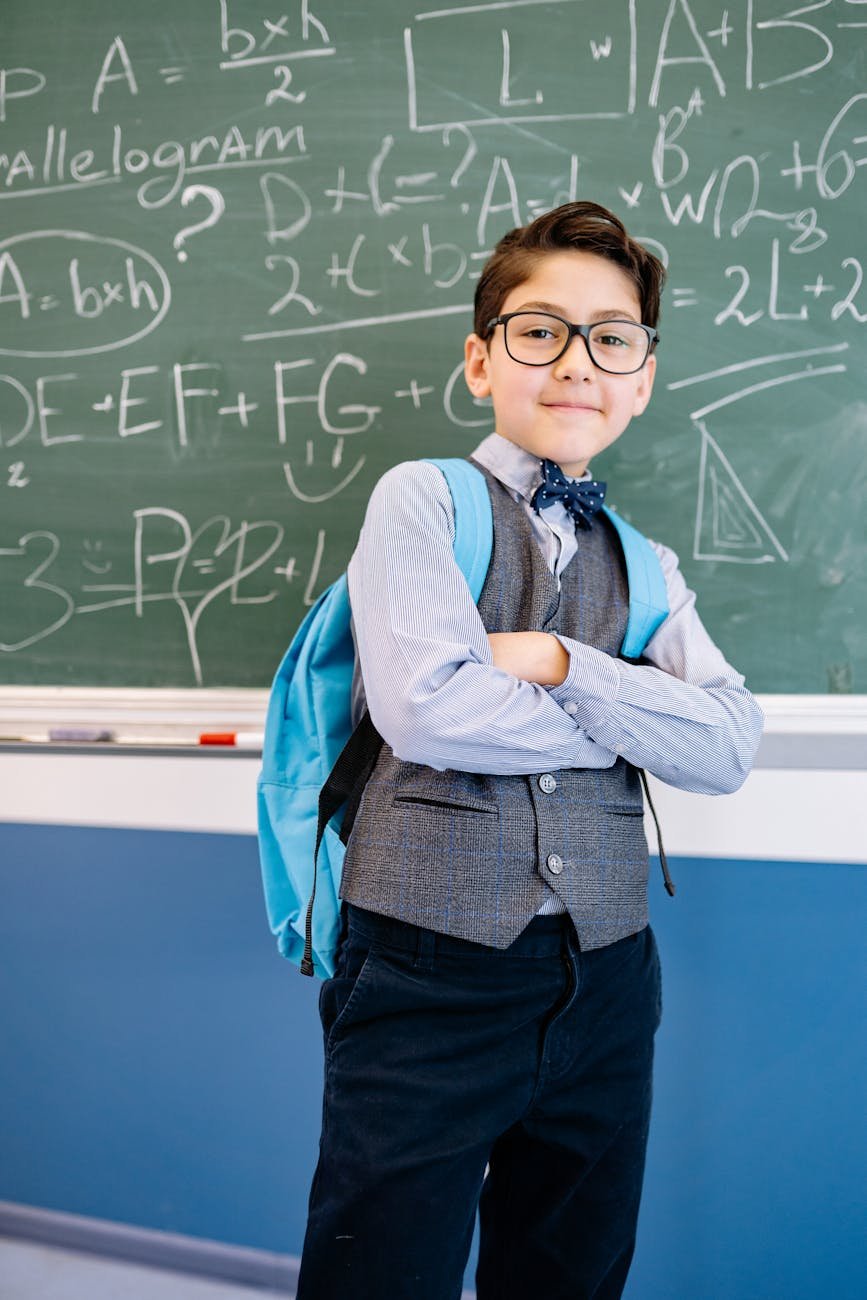 boy carrying a blue backpack