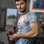 a man holding a tumbler