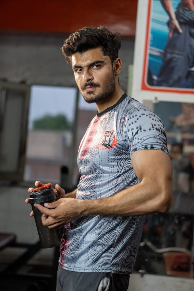 a man holding a tumbler