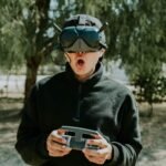 man playing with vr goggles and controller