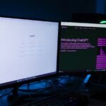 computer with two monitors displaying chatgpt