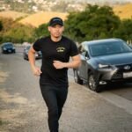 man jogging along street