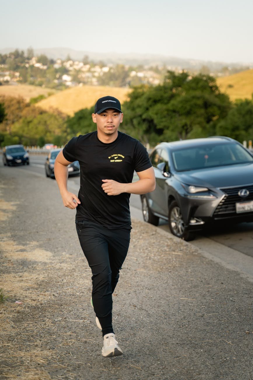 man jogging along street