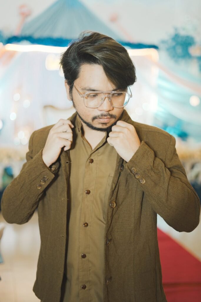 man in brown jacket and jacket fixing collar