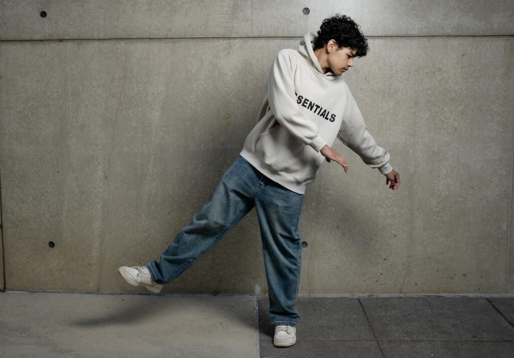 teenager dancing in hoodie