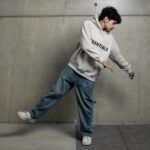 teenager dancing in hoodie