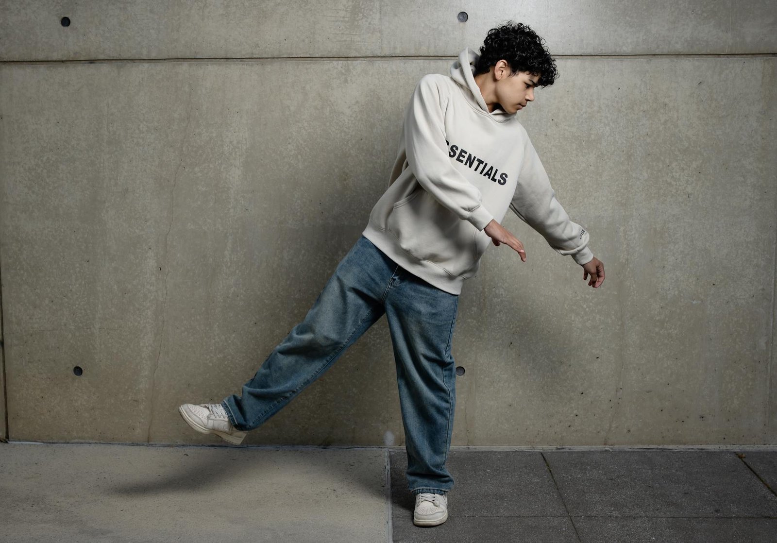 teenager dancing in hoodie