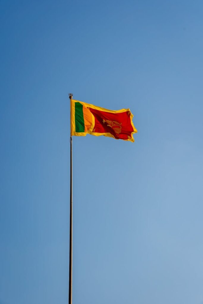 sri lankan national flag against clear blue sky
