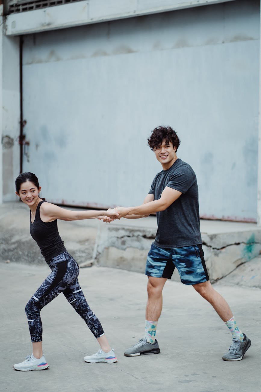 man and woman exercise together