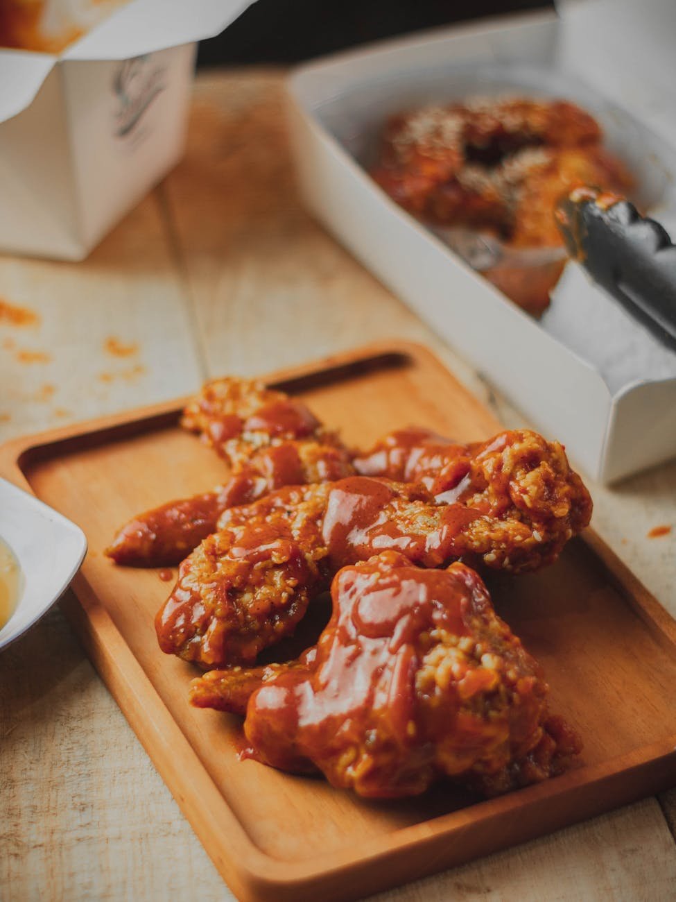 close up of fried chicken covered with sauce