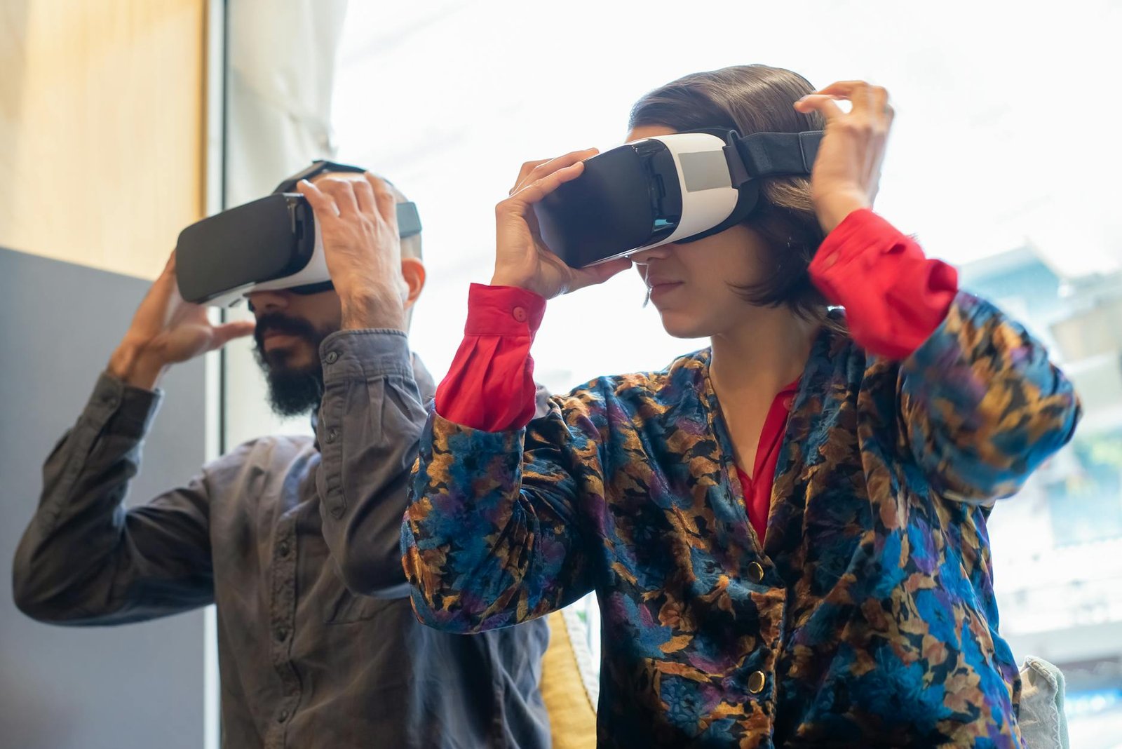 man and woman using virtual reality headsets