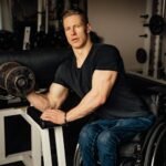 a man doing a dumbbell bicep curl