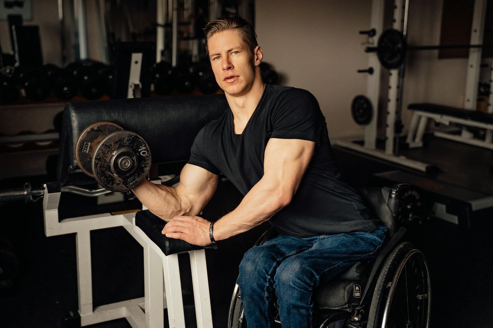 a man doing a dumbbell bicep curl