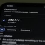 inflation word on smartphone touchscreen