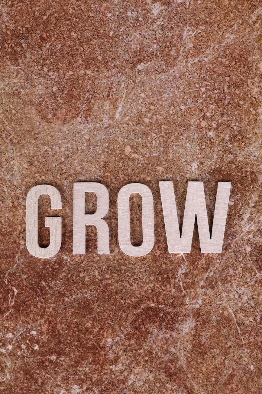 inspirational word grow on rustic background