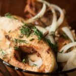 fried fish in close up photography