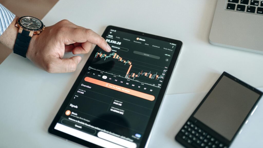 a black tablet with cryptocurrency data on screen