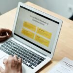 close up shot of a person using a laptop